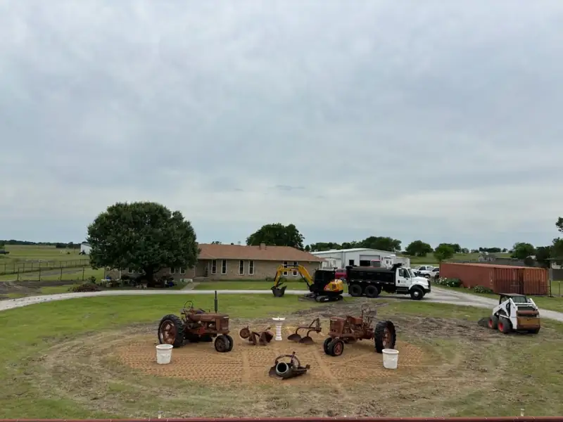 The Scott Ranch yard with tractors, dump trucks, excavator and skid steer